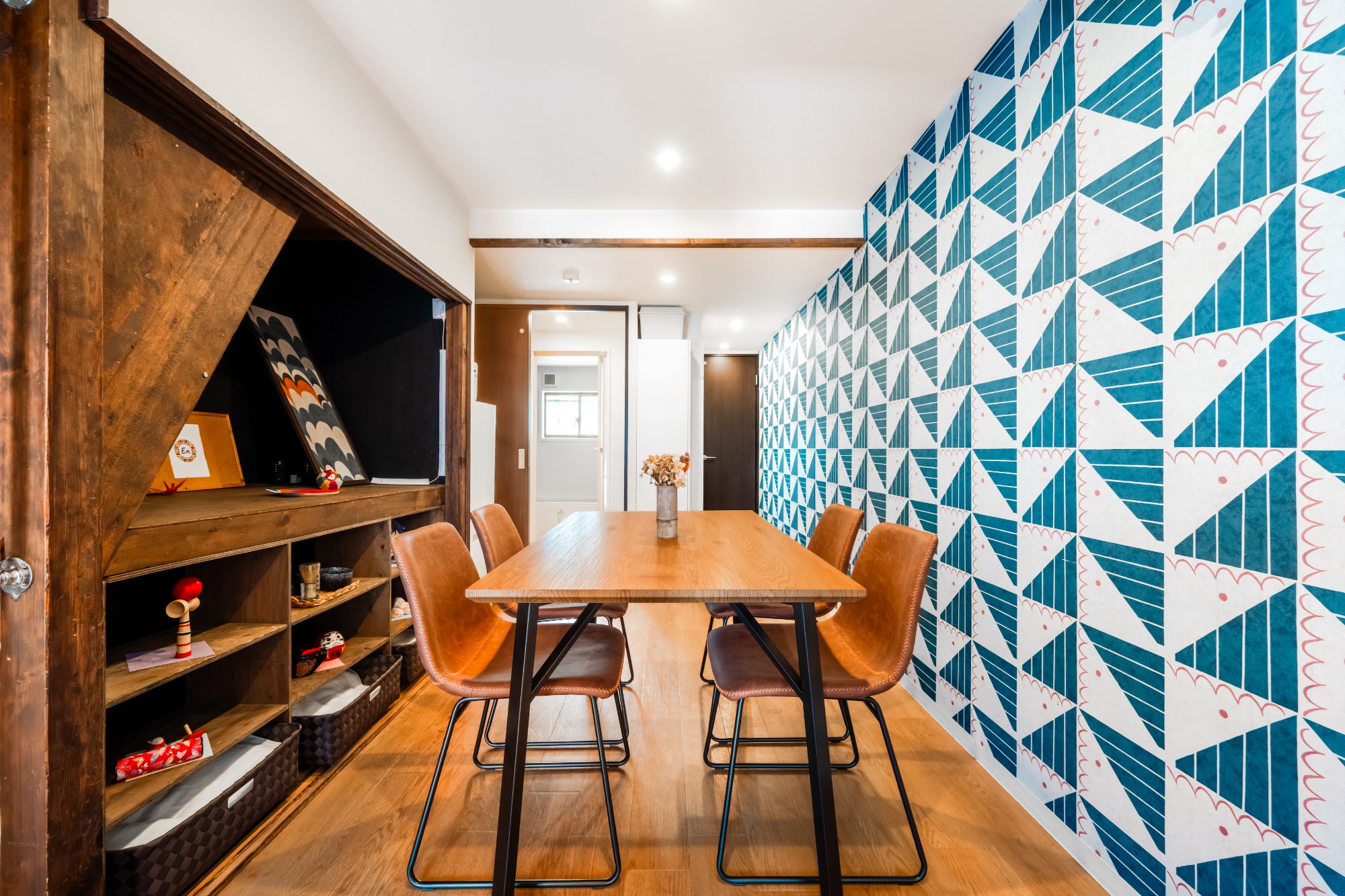 En - dining room with blue geometric wallpaper