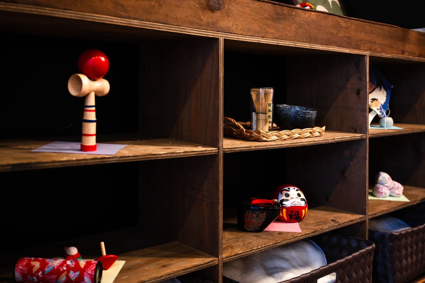 Display shelf with Japanese folk toys and kokeshi dolls