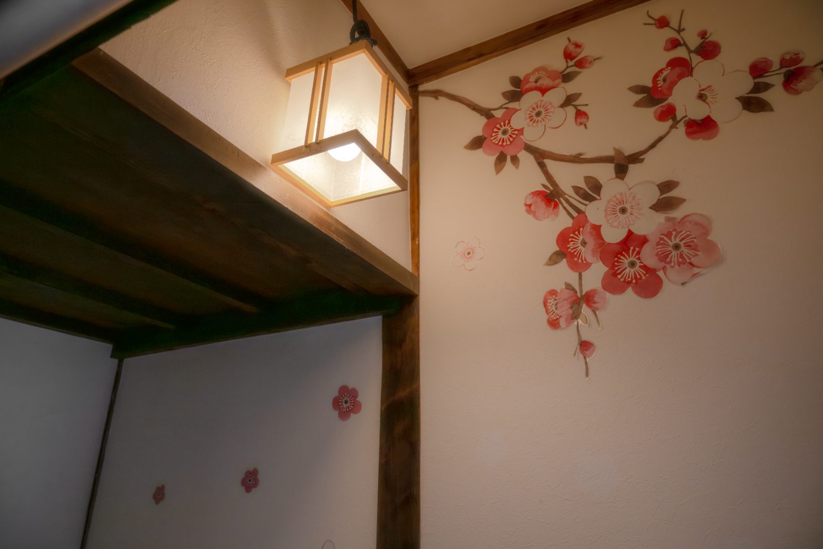 Hand-painted plum blossoms and a paper lantern